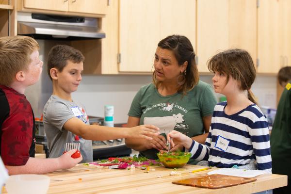 School Programs Coordinator Courtney Mulcahy and students discuss the recipe.