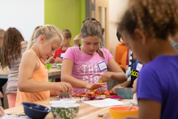 Shelburne Community School students prep salsa ingredients.