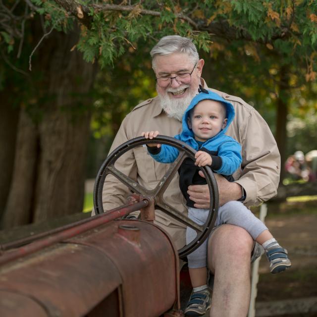 Grandfather and grandson on a tractor