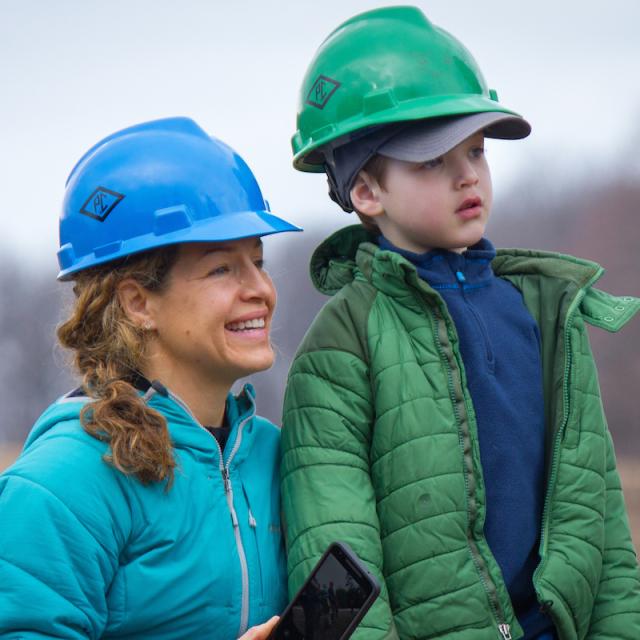 Mother and son in hard hats