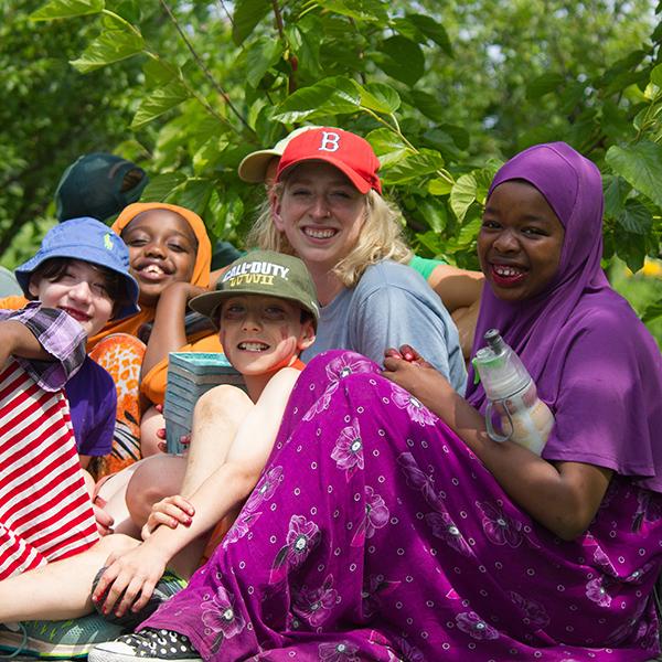 campers and counselor smiling at camera