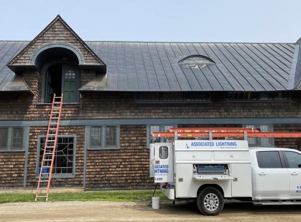 ladder and truck to install cables in the loft spaces of the Farm Barn