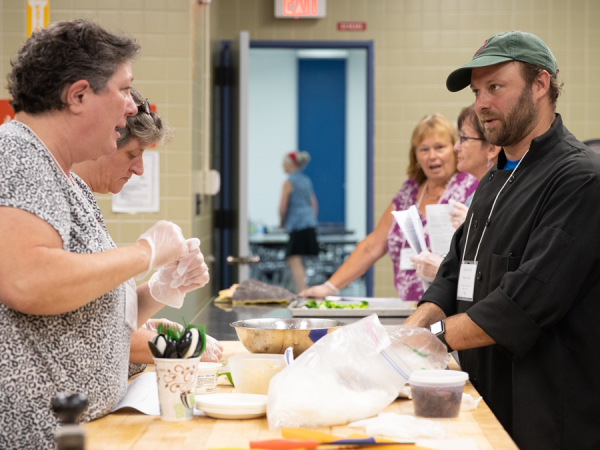 Chef Jim cooking with workshop participants.